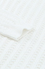 Suéter de punto con hombros caídos y hueco blanco