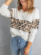 Suéter blanco de punto con cuello en V y bloques de color de leopardo
