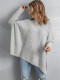 Suéter gris de gran tamaño con cuello alto y aberturas