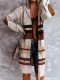 Cárdigan tipo túnica de rayas con bloques de color en el frente abierto