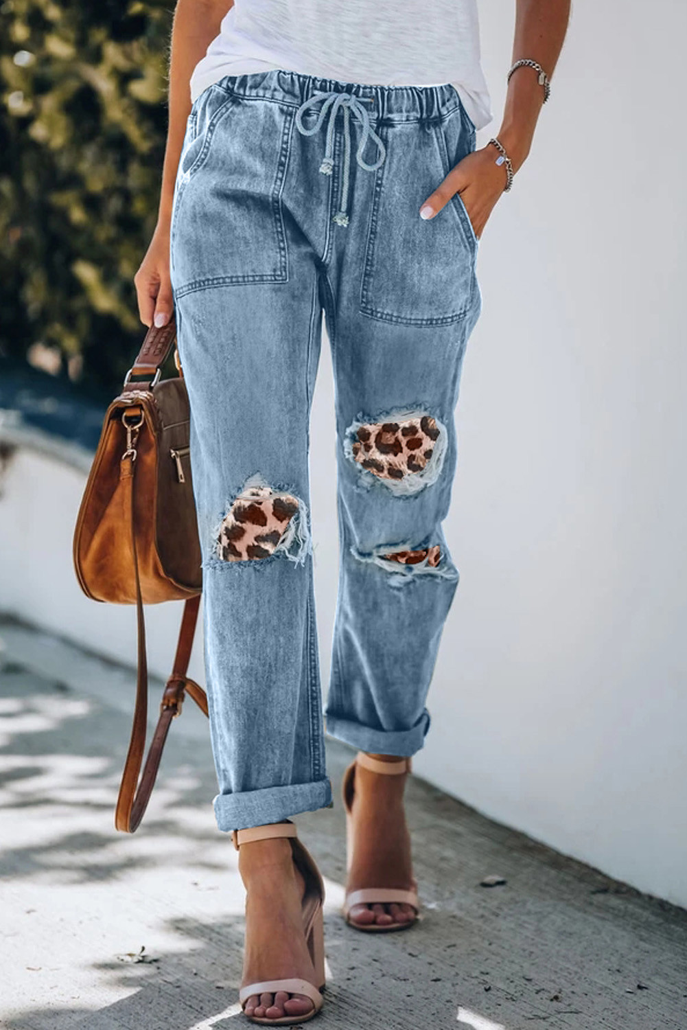 distressed jeans with leopard patches