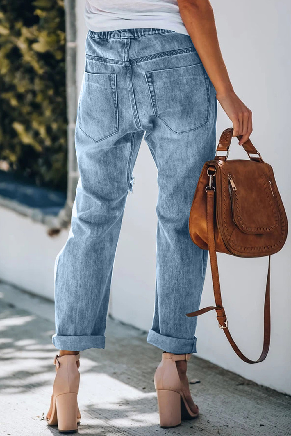 distressed jeans with leopard patches