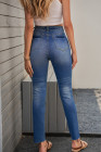 Jeans skinny effetto consumato con orlo grezzo
