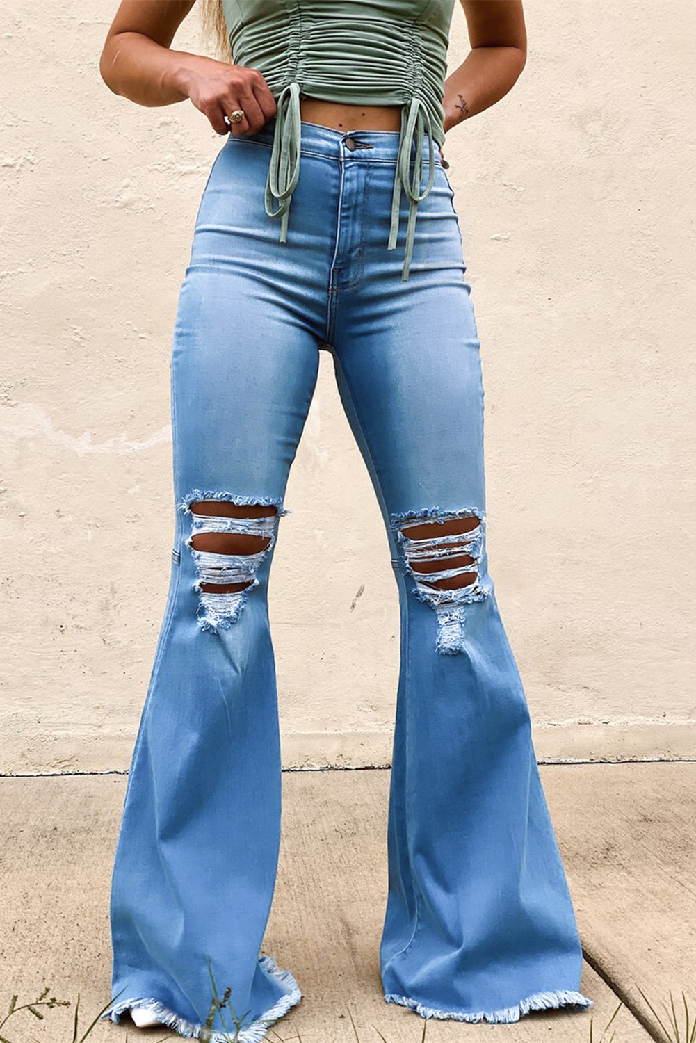 white ripped flare jeans
