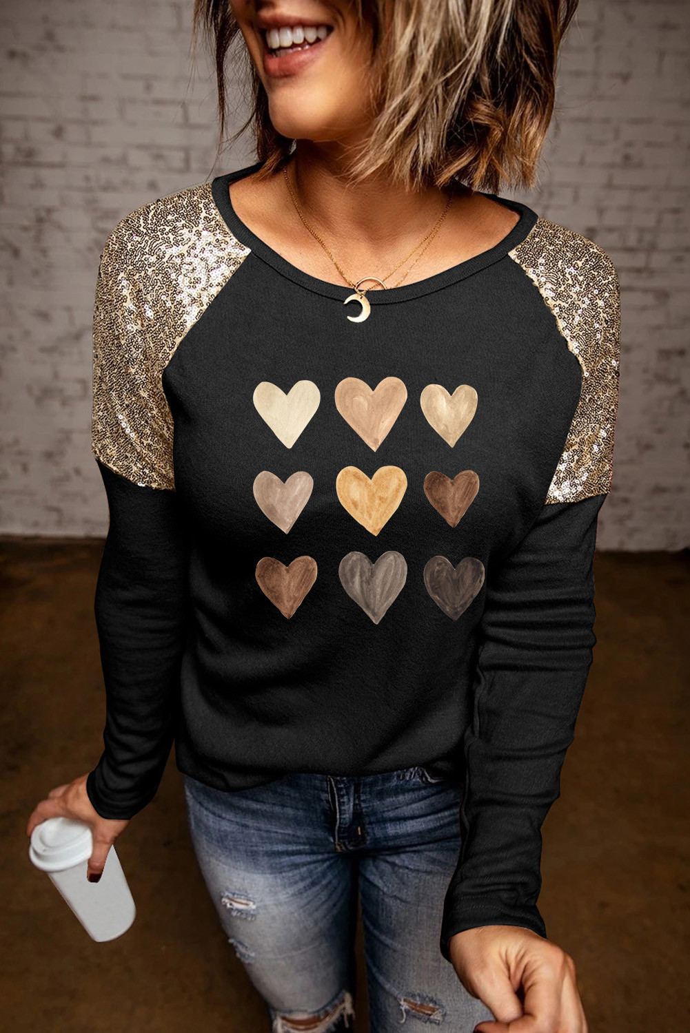 Blusa de manga larga de patchwork de lentejuelas con estampado de corazones de San Valentín negro